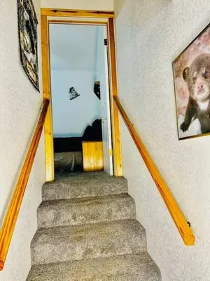 a stairway leading to a door with a stuffed animal at Stay in Yosemite-Cozy Bear North-Sleeps 5 in Yosemite West
