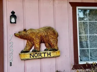 a statue of a bear on the side of a building at Stay in Yosemite-Cozy Bear North-Sleeps 5 in Yosemite West