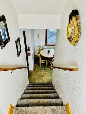 a stairway leading to a room with a table at Cozy Bear South-Inside Yosemite-Sleeps 5 in Yosemite West