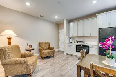 a living room with a table and chairs and a kitchen at 7 Mi to Folsom Lake Sacramento Area Apartment in Folsom