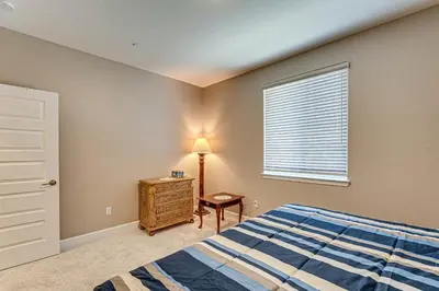 a bedroom with a bed and a table and a window at 7 Mi to Folsom Lake Sacramento Area Apartment in Folsom