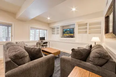 a living room with two couches and a tv at Venture in Tahoe Donner by Tahoe Getaways - 4 BR W Hot Tub, Pool Table, Great for Kids! in Truckee