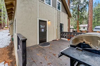 a grill sitting on a patio outside of a building at Kings Beach Cabin Private Hot Tub, Near Lake & Ski in Kings Beach