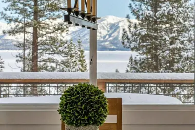 a light sitting on a table in front of a window at Cozy Carnelian Bay Vacation Rental with Lake Views in Carnelian Bay