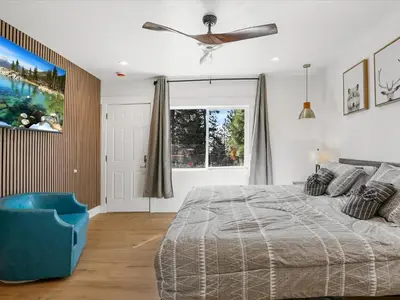 a bedroom with a bed and a ceiling fan at Experience the Beauty of Tahoe from Your Zephyr Cove Retreat! #2 in Zephyr Cove