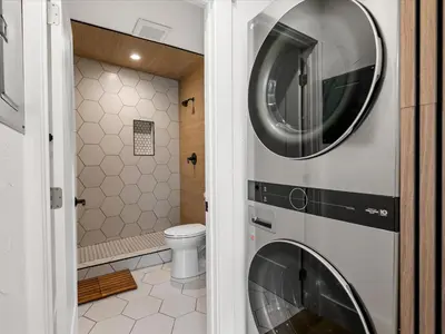 a bathroom with a washer and dryer on the wall at Experience the Beauty of Tahoe from Your Zephyr Cove Retreat! #2 in Zephyr Cove