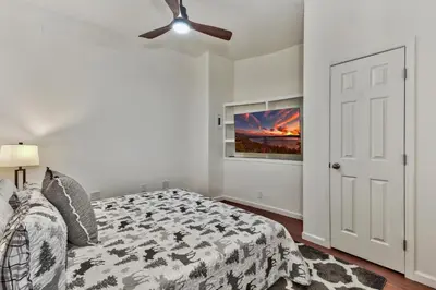 a bedroom with a bed and a ceiling fan at Zephyr Cove first level 1 Bed: close to everything bike, ski, swim! in Zephyr Cove