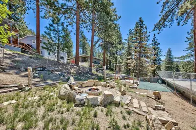 a garden with a fire pit in the yard at First level studio suite close to everything bike, ski, swim Zephyr Cove! in Zephyr Cove