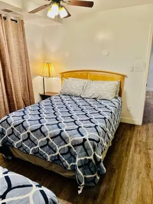 a bedroom with a bed and a ceiling fan at Views inside Yosemite-Timber Lodge-Sleeps 6 in Yosemite West