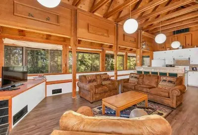 a large living room with couches and a table at Views inside Yosemite-Timber Lodge-Sleeps 6 in Yosemite West