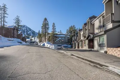 an empty street in a town with snow at Canyon Slopeside Retreat in Mammoth Lakes