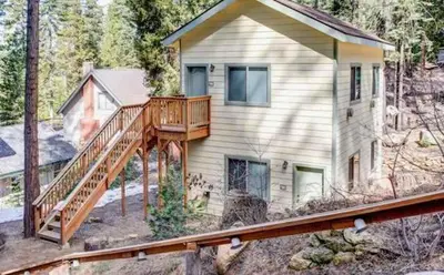 a house with a wooden deck and a house at Lower Unit-Yosemite Woods-Inside Yosemite in Yosemite West