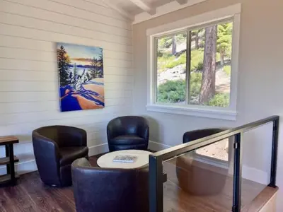 a room with two chairs and a table and a window at Lake Tahoe Vacation Rental Fireplace and Balcony in Incline Village