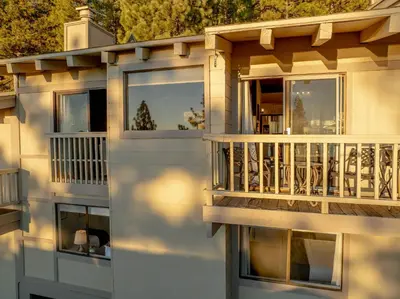 a house with a balcony and a reflection in the window at Lake Tahoe Vacation Rental Fireplace and Balcony in Incline Village