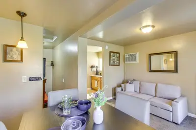 a living room with a table and a couch at Lake and Mountain Views Cozy California Stay in Mountain Mesa