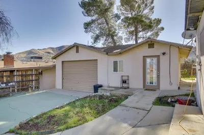 a house with a garage and a driveway at Lake and Mountain Views Cozy California Stay in Mountain Mesa