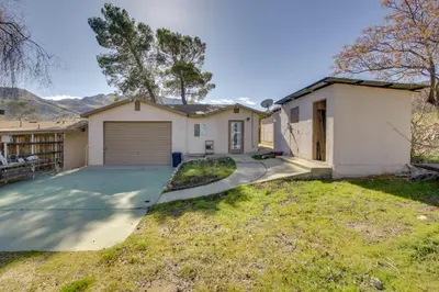 a house with a garage and a driveway at Lake and Mountain Views Cozy California Stay in Mountain Mesa