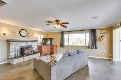 a living room with a couch and a fireplace at 6 Mi to Lake Isabella Mountain Mesa Getaway in Mountain Mesa