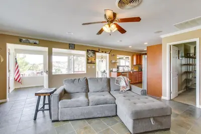 a living room with a couch and a ceiling fan at 6 Mi to Lake Isabella Mountain Mesa Getaway in Mountain Mesa