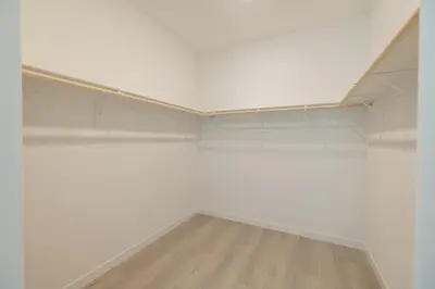 an empty room with white walls and a wooden floor at Modern Charming 4BR Home, Family Friendly, Office Space, Fast WiFi, Free Parking in Folsom