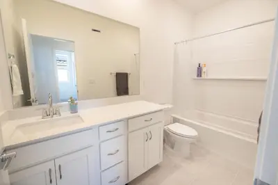 a bathroom with a sink and a toilet and a tub at Modern Charming 4BR Home, Family Friendly, Office Space, Fast WiFi, Free Parking in Folsom