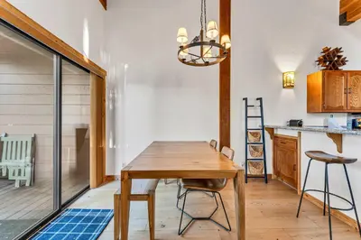 a dining room with a wooden table and chairs at Cozy Mountain Retreat in Truckee Near Northstar in Truckee