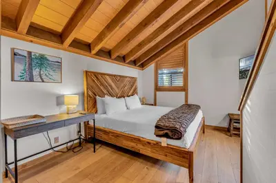 a bedroom with a bed and a desk in it at Cozy Mountain Retreat in Truckee Near Northstar in Truckee