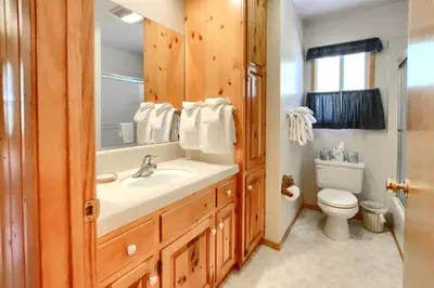 a bathroom with a sink and a toilet at Shangri la-de-da at The Redwoods in Wawona