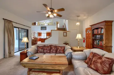 a living room with a couch and a table at Cabin Among the Firs in Wawona
