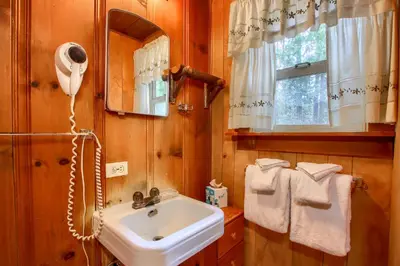 a bathroom with a sink and a mirror at Le Fawn in Wawona