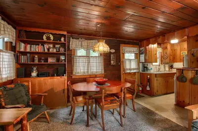 a dining room with a table and chairs at Le Fawn in Wawona