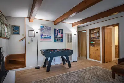 a living room with a ping pong table in it at Yosemite Retreat in the Meadows in Wawona