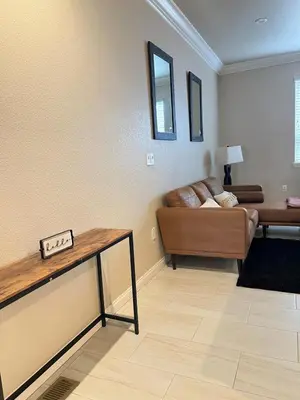 a living room with a couch and a table at 30Min To SouthTahoe 3BD Parking in Carson City