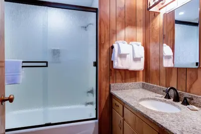 a bathroom with a shower and a sink at Robin's Nest in Wawona