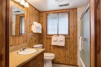 a bathroom with a sink and a toilet and a window at Bird's Eye View in Yosemite West