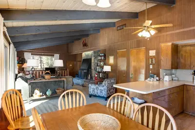 a kitchen with a table and chairs and a fireplace at Bird's Eye View in Yosemite West