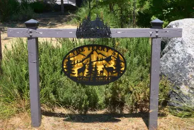 a sign for a park with animals on it at The Terry Cabin in Wawona