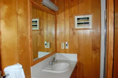 a bathroom with a sink and a mirror at River Song in Wawona