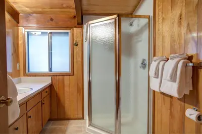 a bathroom with a shower and a sink at Cutter's Edge in Wawona