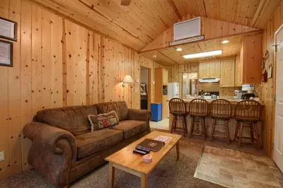 a living room with a couch and a table at Edna's Hearts Desire in Wawona