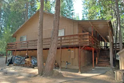 a tree house in the middle of the forest at Altitude Adjustment in Wawona