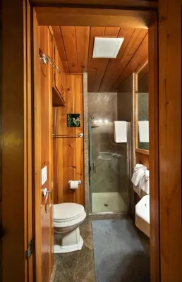 a bathroom with a toilet and a shower and a sink at Sugar Pine Suite in Wawona