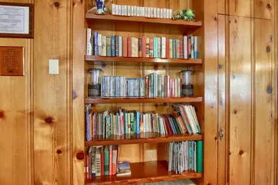 a book shelf filled with lots of books at Deer Creek in Wawona