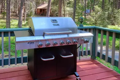 a grill sitting on top of a deck at The Williams Cabin in Wawona