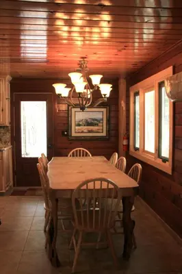 a dining room with a wooden table and chairs at Grizzly Giant in Wawona