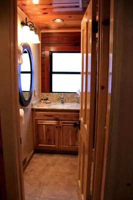 a bathroom with a sink and a mirror at Grizzly Giant in Wawona