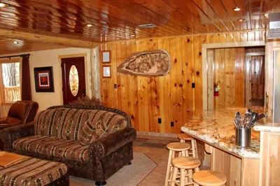a living room with a couch and a table at Grizzly Giant in Wawona