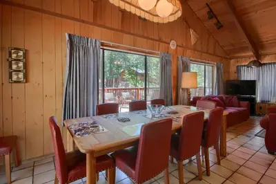 a dining room with a table and chairs at Bordentown West in Wawona