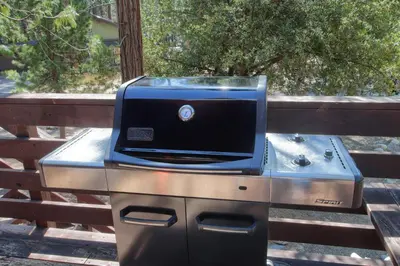 a toaster oven sitting on top of a grill at Simmons Den in Wawona