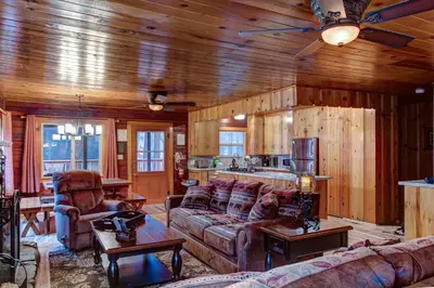 a living room with a couch and a table at Our Yosemite Getaway in Wawona
